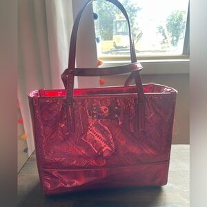 Hot pink holographic Kate spade purse